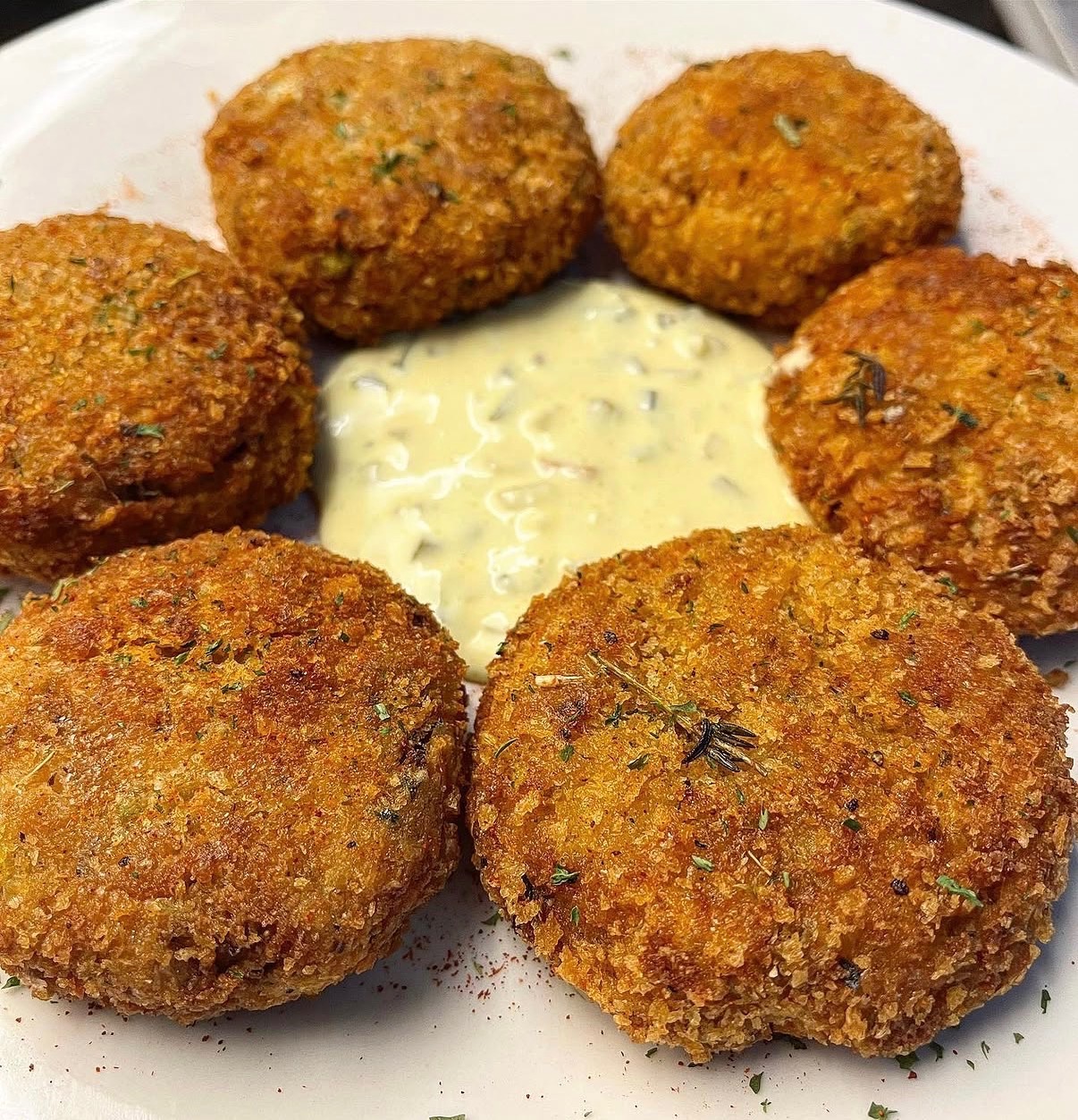 Golden salmon cakes with a creamy dipping sauce
